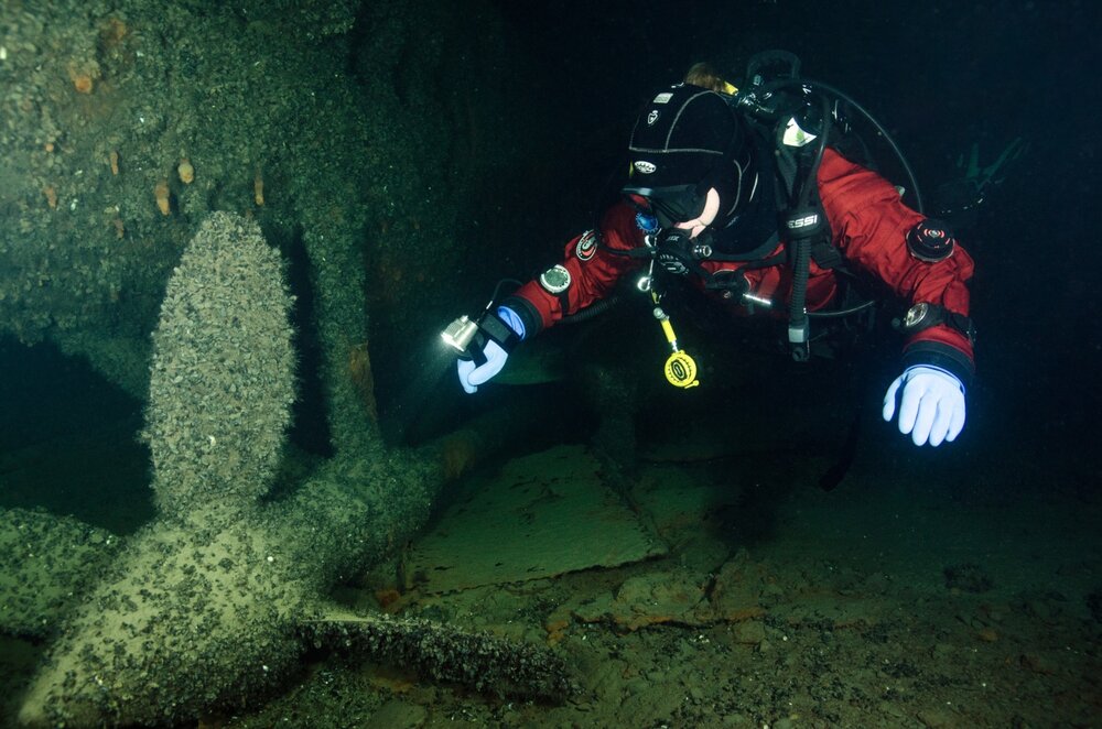 A diver gives perspective to the propeller of the WW1 Russian submarine wreck, the Akula, lying in 34 metres of water in the Estonian Baltic Sea.