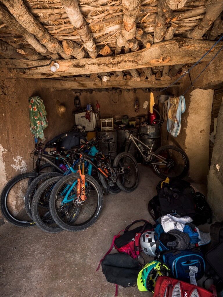 Team bikes sit in a homestay outbuilding. Accommodation on the trip ranged from gold-trimmed hotels to homestays and mountain camps