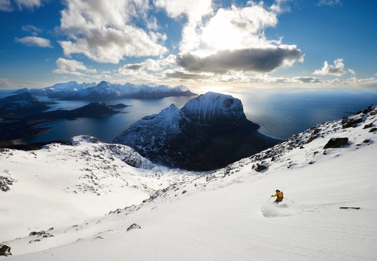 Al Todd beginning the 900m descent down the south face of Himmeltindan on the stunning island of Vestvågøya in the heart of the Lofoten Islands.