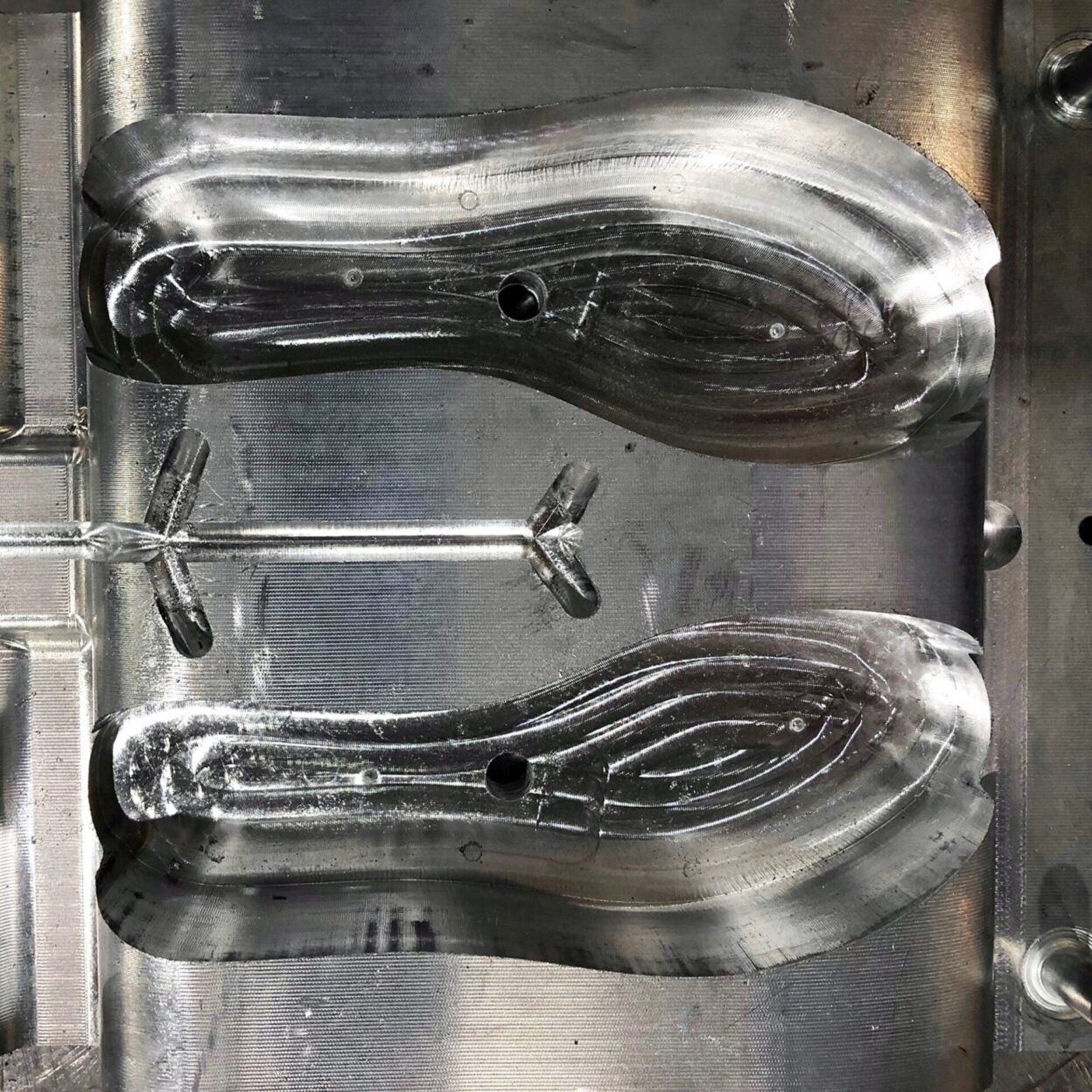 Insole moulds being manufactured in a stainless steel mould press.