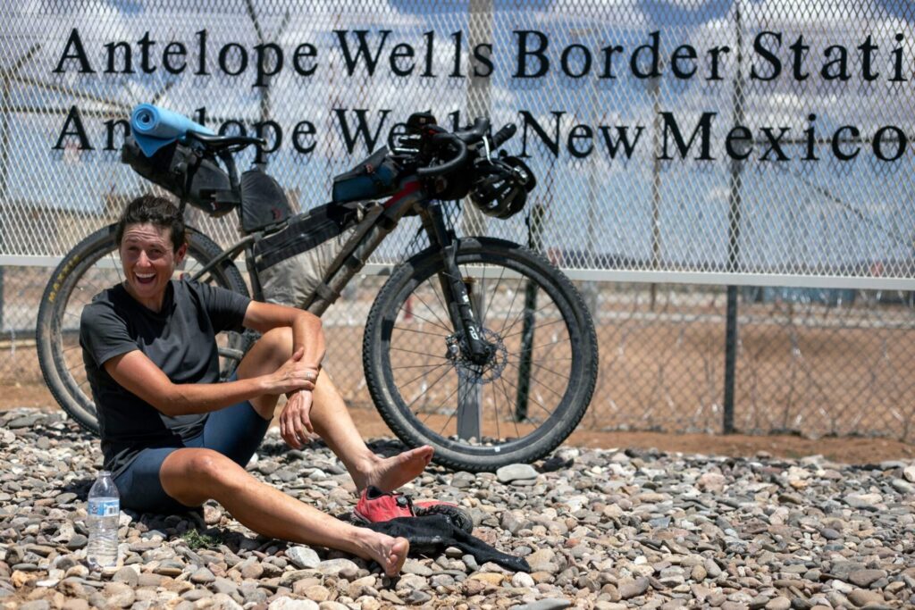Lael at Antelope Wells, New Mexico, having just finished the 2100 mile Tour Divide race starting in Banff, Canada. © Rugile Kaladyte / komoot