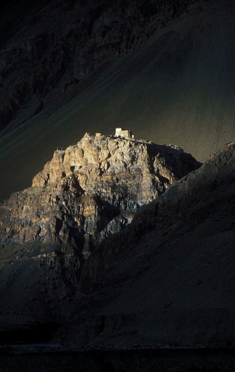 Zangla Gompa spotlit by the last rays of sunlight. Zangla is an ancient monastery above the Zanskar river a few miles downstream from Padum, the regional capital.