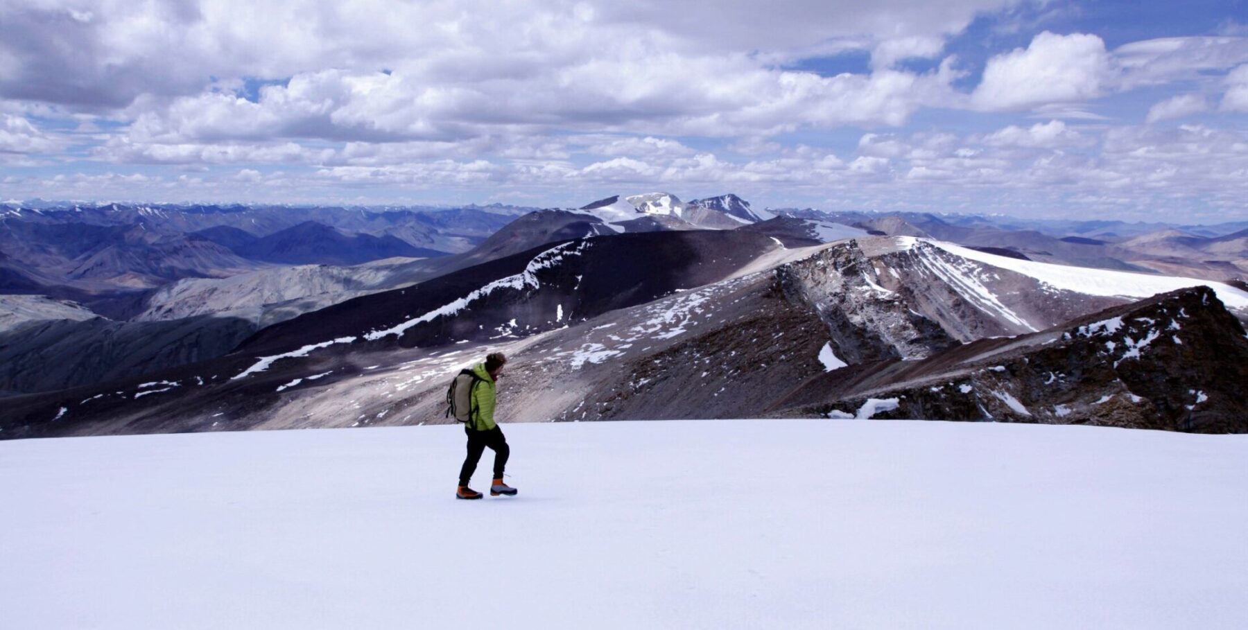 Looking towards the mountains of Zanskar from the summit icefield of Mentok II (6,150m), Mentok Group, Tso Mori region, Ladakh.