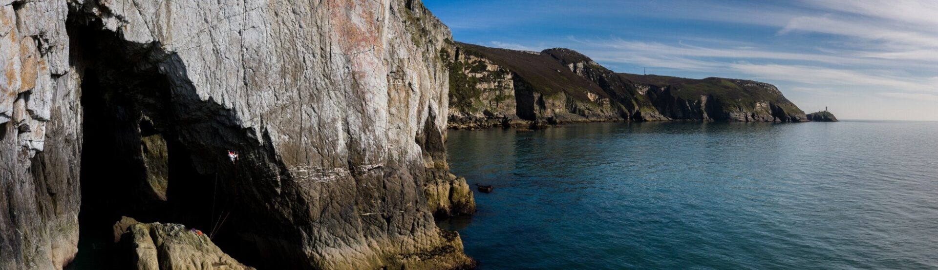 Alex Mason Powell climbing out of the cave on Billy Bud, Gogarth