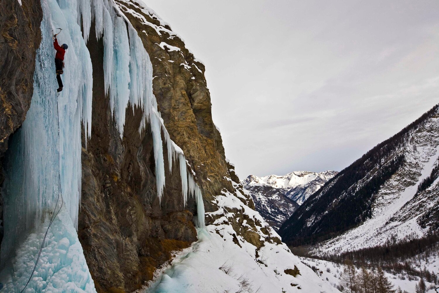 James Harrison searches for a solid axe placement on the steep crux section of Davidoff (WI5) in the ice climbing paradise of the Fournel Valley, high above L’Argentière-la-Bessée, home to the Ecrins Ice Climbing Festival held every year in January (ice-climbing-ecrins.com).