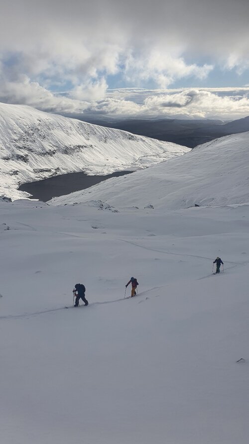 Skinning up through fresh snow above Ffynnon Llugwy. Days like this are a rare treat in Snowdonia. © Tom Laws