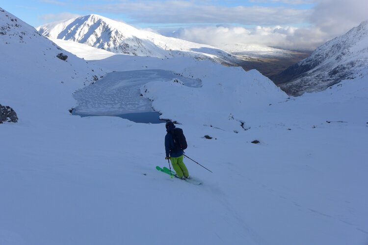 Cruising back while calculating how much more skiing can be done before dark. © Callum Muskett