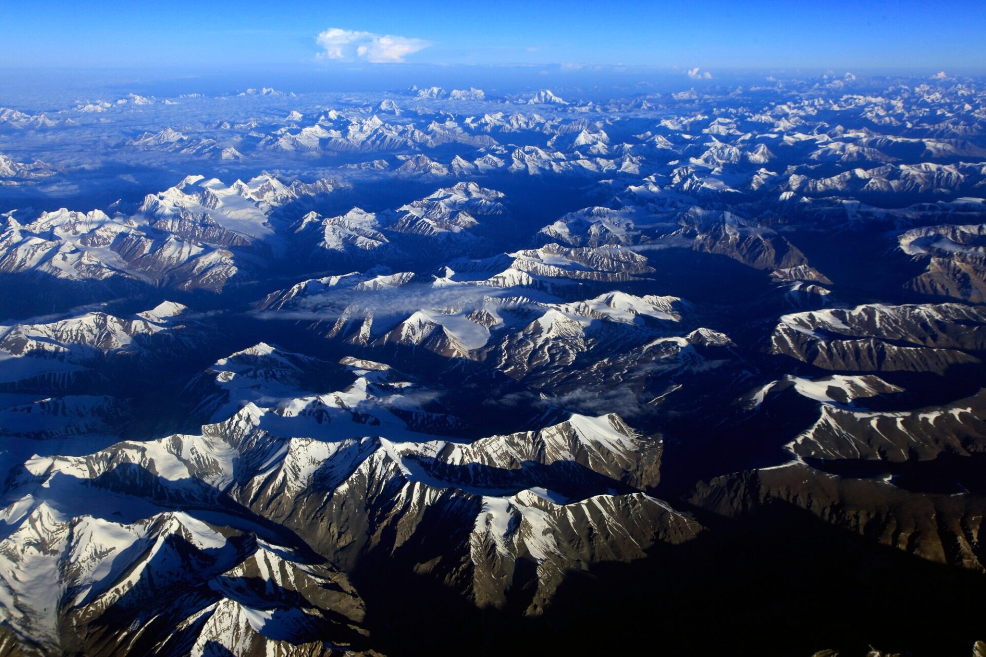 The high mountains of the Zanskar Rnage in the Indian Himalaya seen from the air. In terrain like this, having GPS navigation (and the ability to use it) is extremely useful - as is the skill of old-school navigation via map reading and using compass bearings.