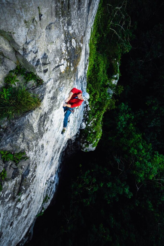 Jamie Barclay on Sangfroid Direct (E2 5c) at Craig Y Forwyn in North Wales. With a long history of access issues, Craig y Forwyn was out of bounds to climbers for decades. Yet it has recently been opened up yet again; an opportunity to enjoy some of the best inland limestone in Britain, providing the delicate relations with the landowners remain respected.