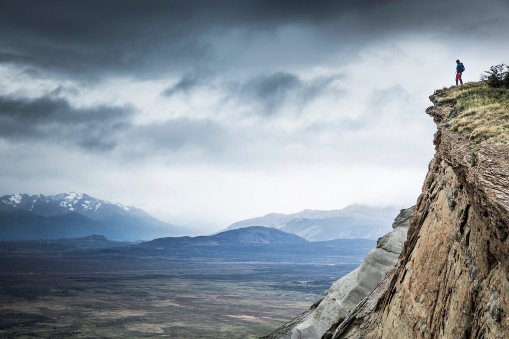 Peering out over the cliffs of Dorotea in the Torres del Paine National Park to spot condor - the largest terrestrial bird on Earth.