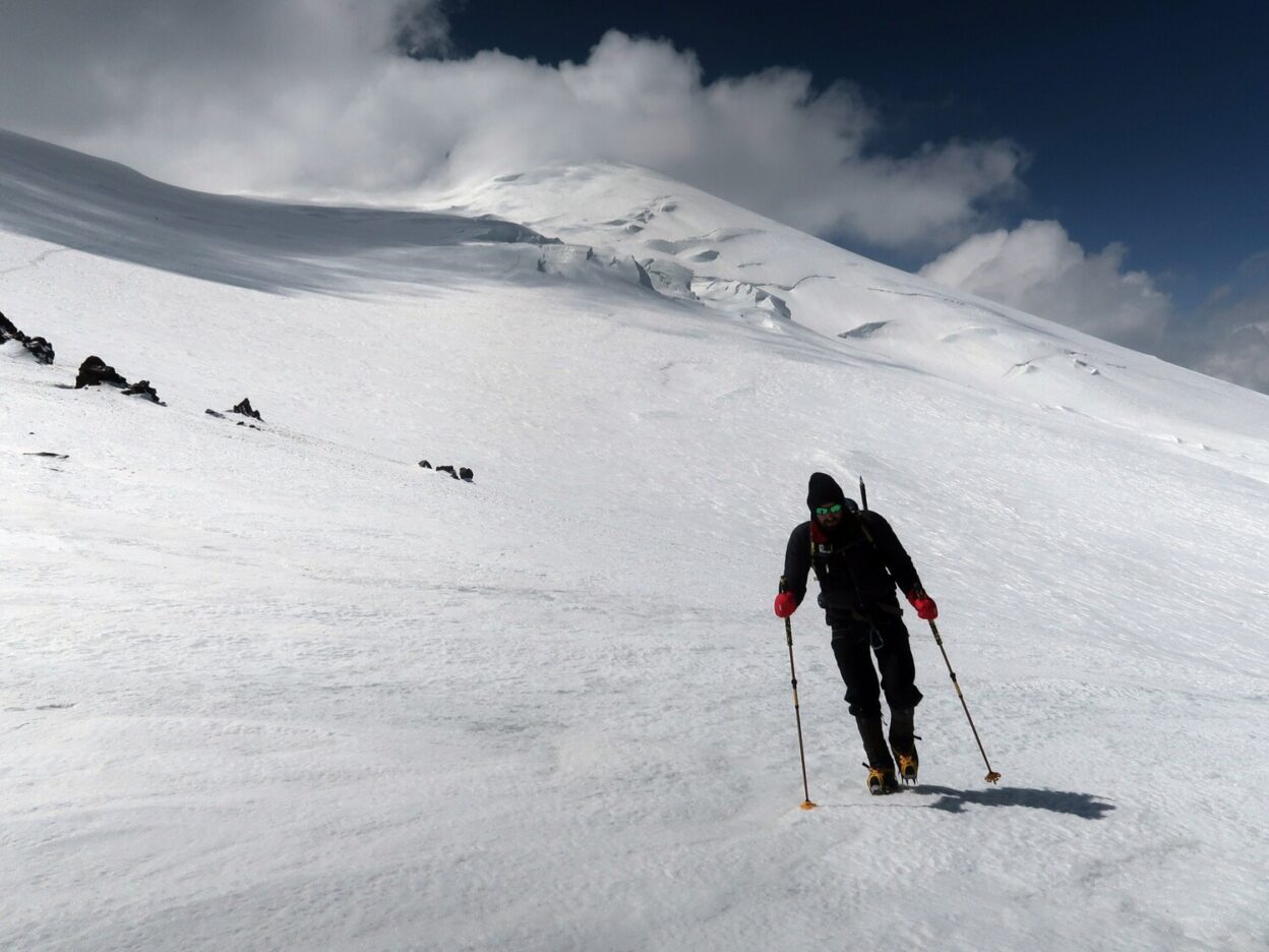 Not a place to be without a decent waterproof shell: Graham Taylor strikes out for the summit above Lenz Rocks on the north side of Mount Elbrus (5,642m), Russian Federation. © David Pickford