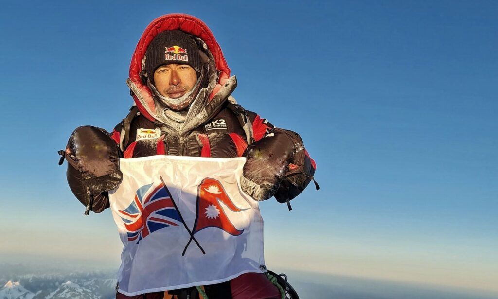 Nims holds a flag with the Union Jack and the Nepali flag together on the summit of K2 (8,611m), the world’s second-highest mountain and the most northerly 8000m peak, during the first winter ascent on January 16th 2021. © Team Nimsdai