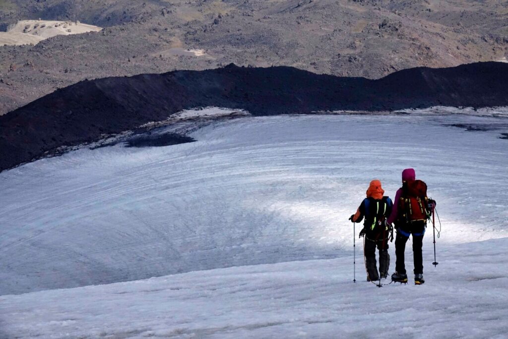 Two climbers making the long final descent back down the Bourbzalitchiran glacier to North Hut after a successful ascent of Elbrus.