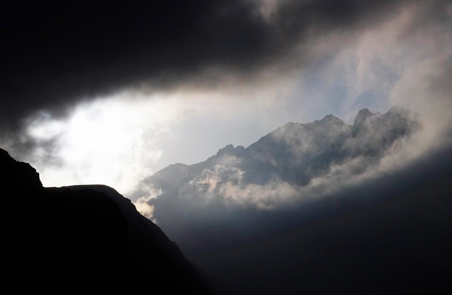 An incoming storm above advance camp at North Hut.