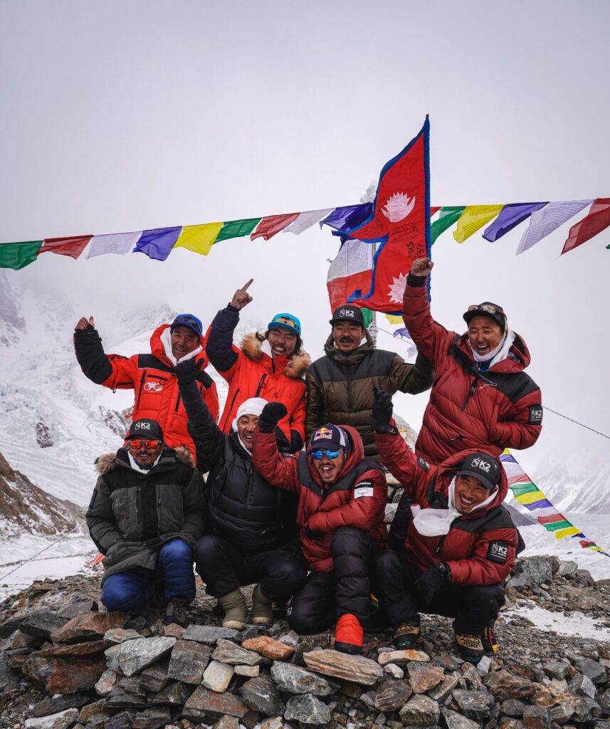 ‘Team Nimsdai’ after the first winter ascent of K2. The group, who all summited the mountain together, consisted of Mingma Gyalje Sherpa, Nirmal Purja, Gelje Sherpa, Mingma David Sherpa, Mingma Tenzi Sherpa, Dawa Temba Sherpa, Pem Chhiri Sherpa, Kilu Pemba Sherpa, Dawa Tenjing Sherpa, and Sona Sherpa. Nims was the only climber in the team who reached the summit without the use of supplementary oxygen. At the summit, the temperature that day was -40ºCelsius, plus windchill. © Sandro Gromen-Hayes / Team Nimsdai