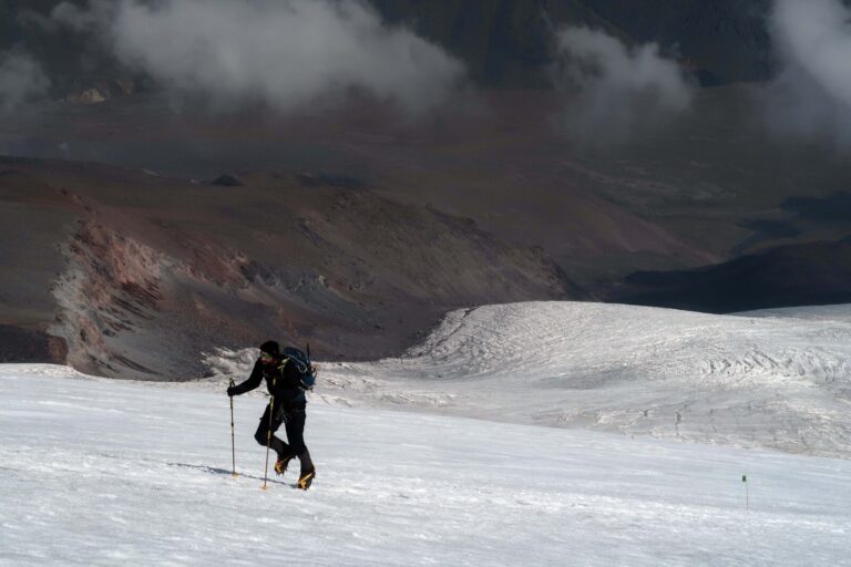 A climber feeling the altitude burn at 4500m on an acclimatisation hike on the Bourbzalitchiran glacier, high above North Hut. Several acclimatisation days are needed even for the fittest climbers coming from low altitudes before a successful ascent of Mount Elbrus.