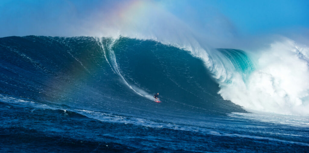 Keala Kennely uses a CO2 buoyancy vest on a big day at Jaws in Maui. © Fred Pompermayer / Red Bull