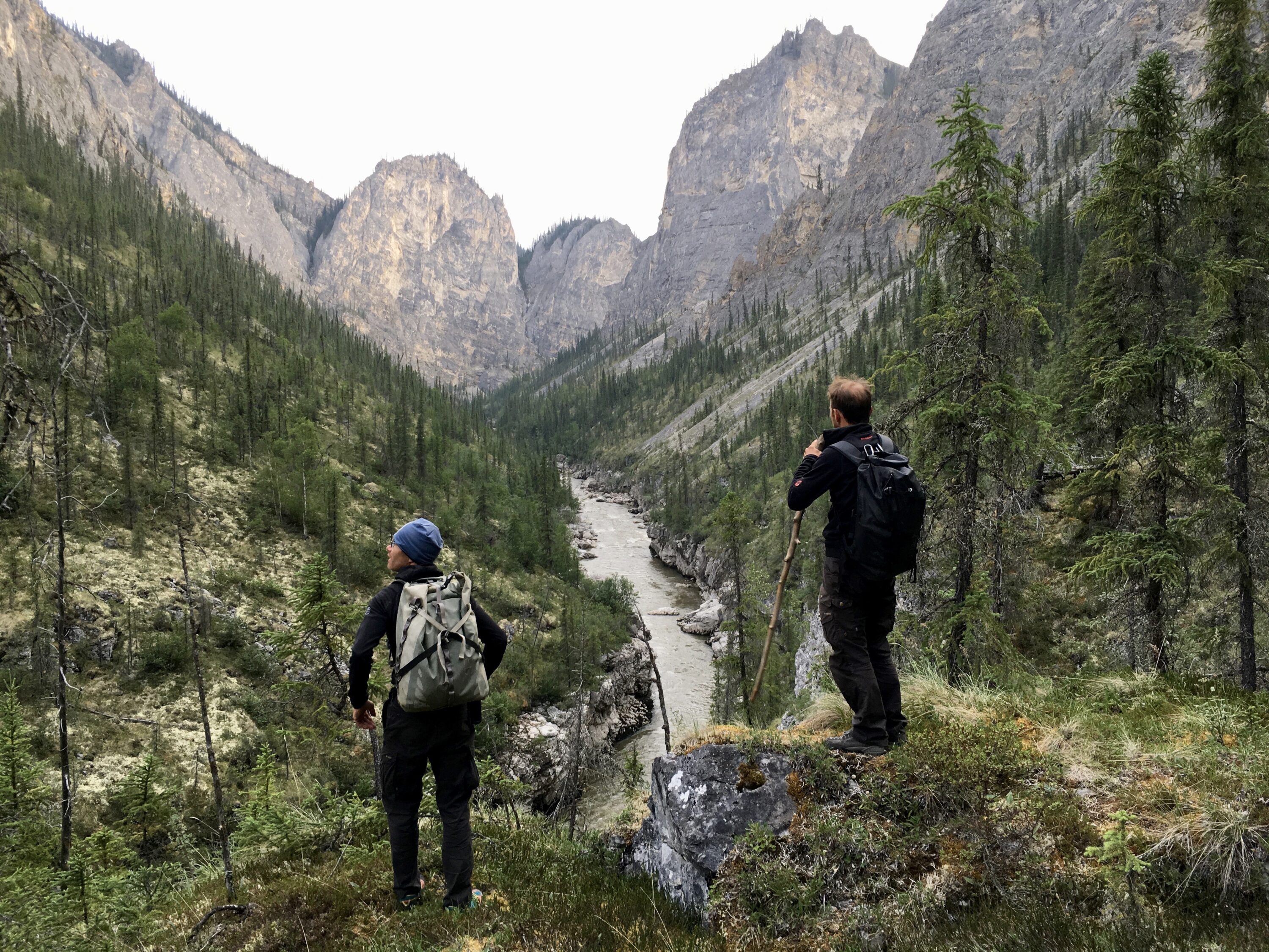 Oliver Armann and Ueli Staub take a moment to appreciate their surroundings and asses their next steps as they begin their portage through the Eye of the Needle Canyon.