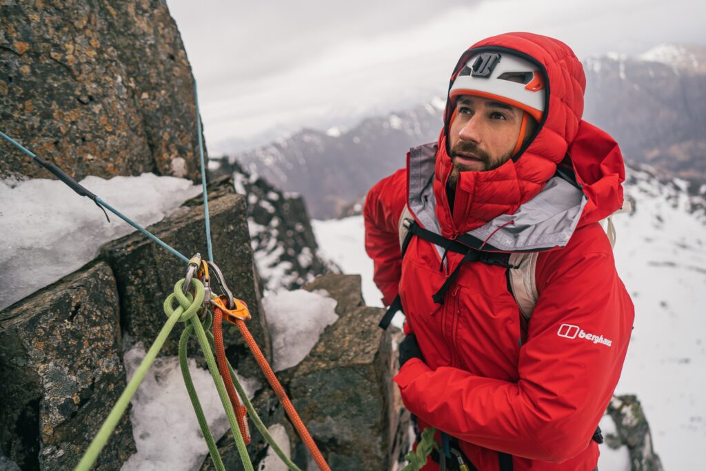 Adam at a belay on Dorsal Arete in Stob Coire Nan Lochan, Glencoe, Scotland. From a Berghaus Extrem photoshoot. © Hamish Frost / Berghaus